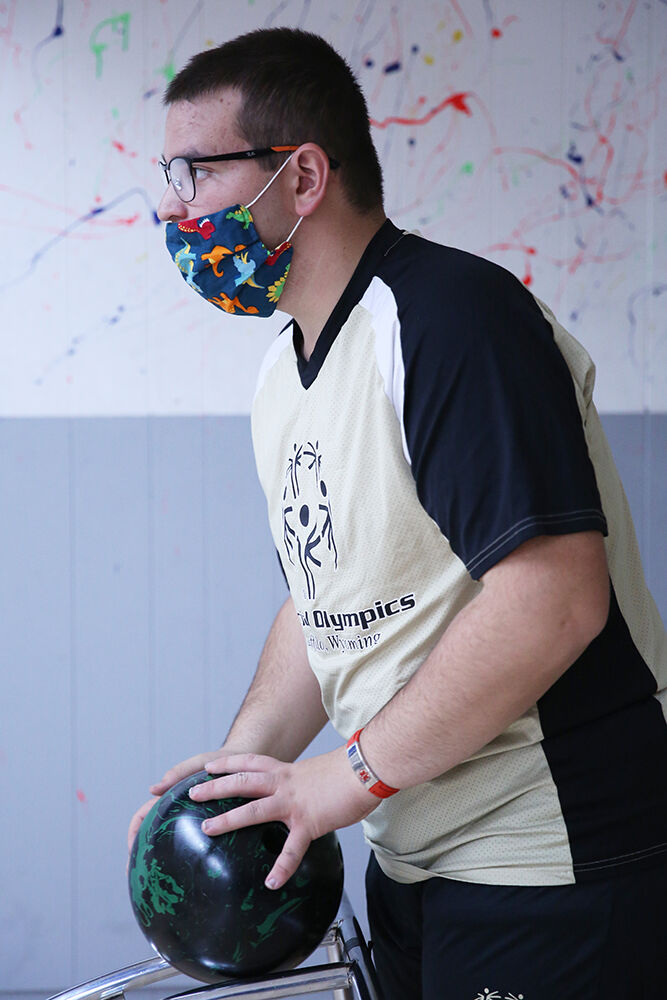 Kolton Maes looks down the lane before pushing his ball down the bowling ramp